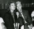 Susan Sarandon, David Bowie   1983 NYC cliff AC.jpg